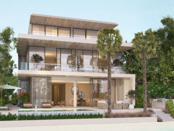 Modern beachfront villa surrounded by greenery