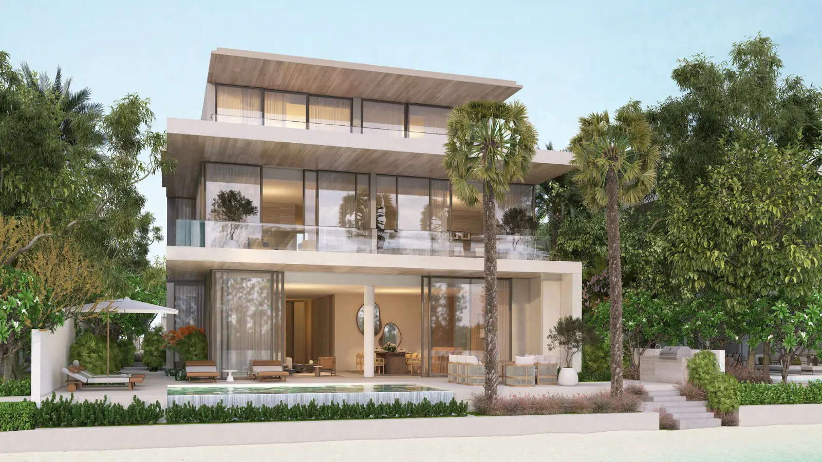 Modern beachfront villa surrounded by greenery
