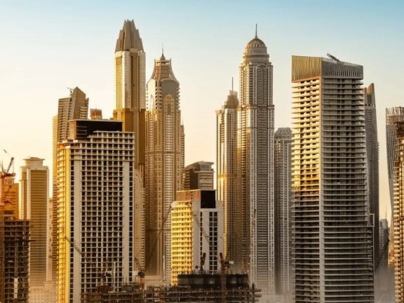 Modern skyscrapers against sunset sky