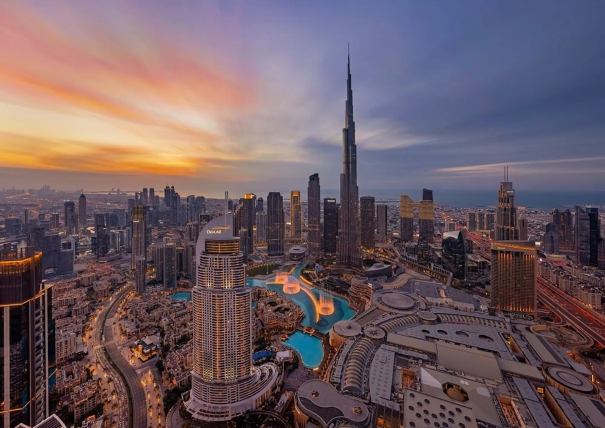 Dubai skyline at sunset with skyscrapers